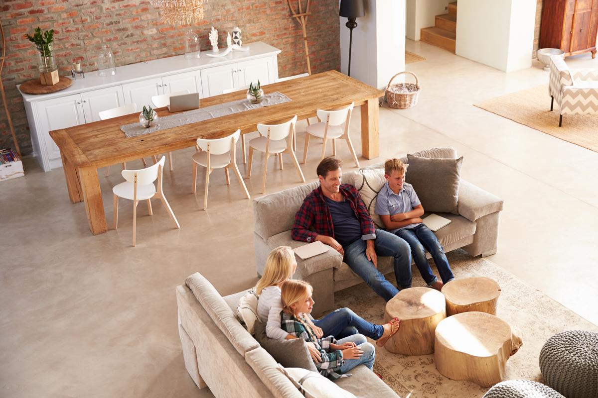 Family in living room watching television.